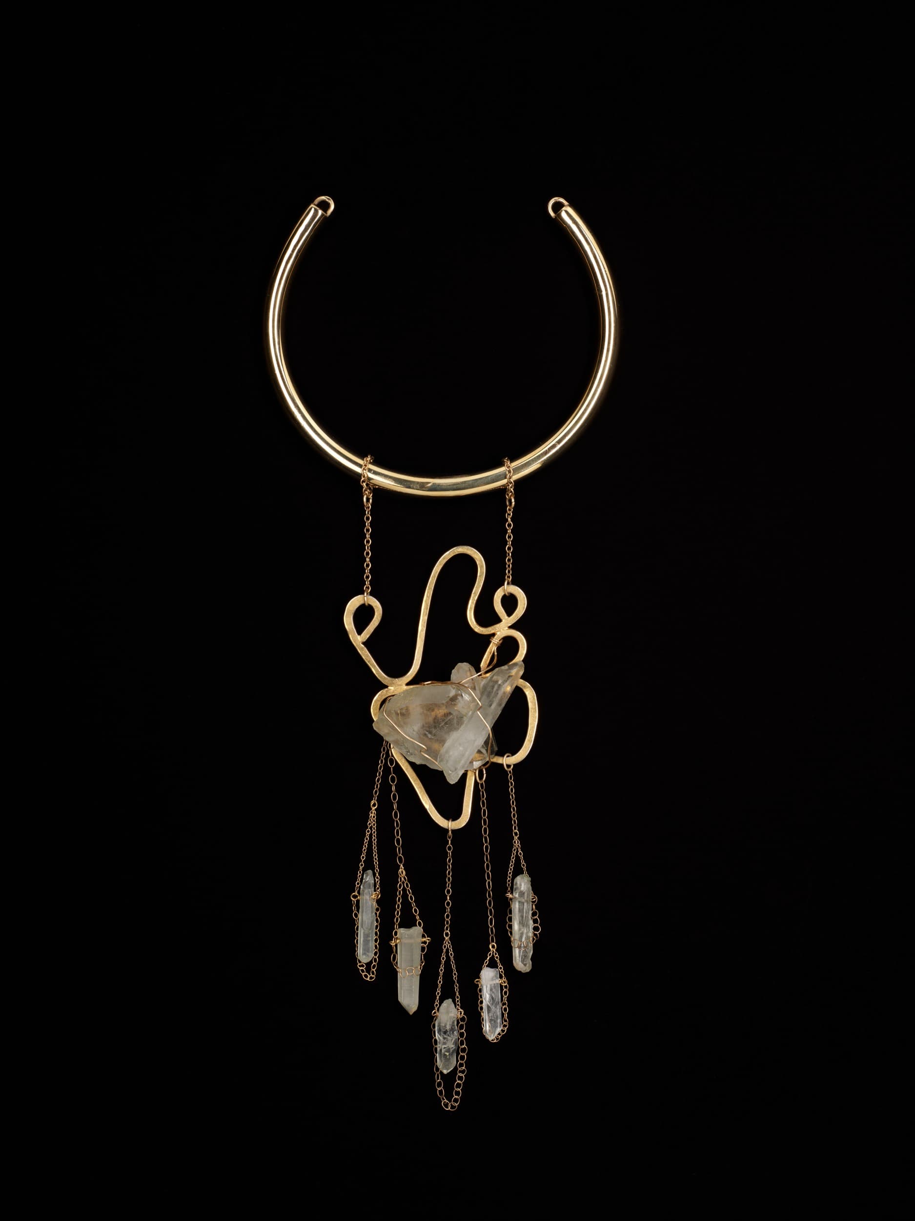 Douriean Fletcher, Necklace from the "Messengers" collection [M3], 2016 (re-created 2025). Gold-plated brass, gold-plated copper, gold-filled chain, gold-filled wire, and quartz. Courtesy the artist.